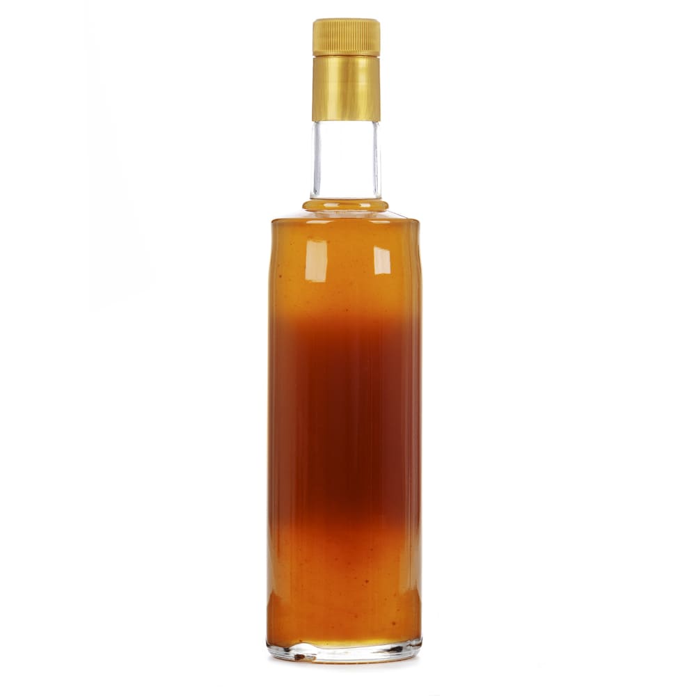Licor de orujo con miel de romero en botella de cristal reverso